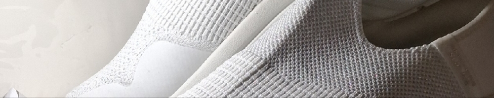 Skechers White Slip-Ons with Gray Accents